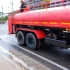 worker-on-fire-truck-spraying-water-on-the-road-fo-2025-06-30-23-33-44-utc(3)
